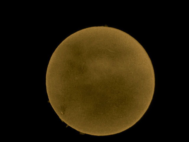 Full face of Sol By Tony Hayes. 18th April 16:54. Sony DSC-w-800, f/5.1: 1/250 second: ISO-160 .  A single shot through the eyepiece of the Lunt 35mm H-A telescope. The camera had a focal length of 16mm and max aperture of 3.356  hand held at the telescope eyepiece. Surface detail is good and the whitish spot bottm left is AR 2529 just a day or so before disappearing from view.